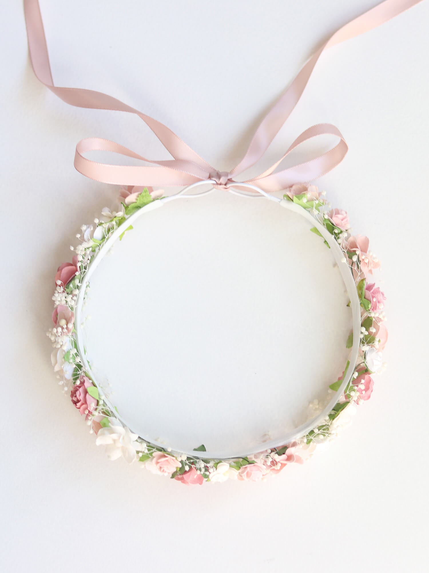Elsie girls flower crown in dusty rose shown from above, showing the tie back ribbon on the flower crown.