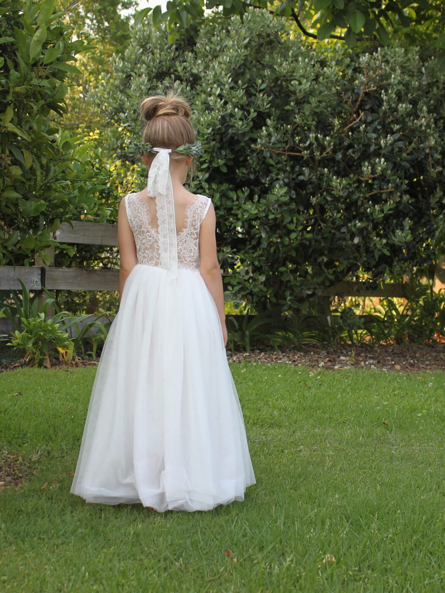 Mia ivory lace and tulle flower girl dress shown from behind. Showing the beautiful lace detailing.