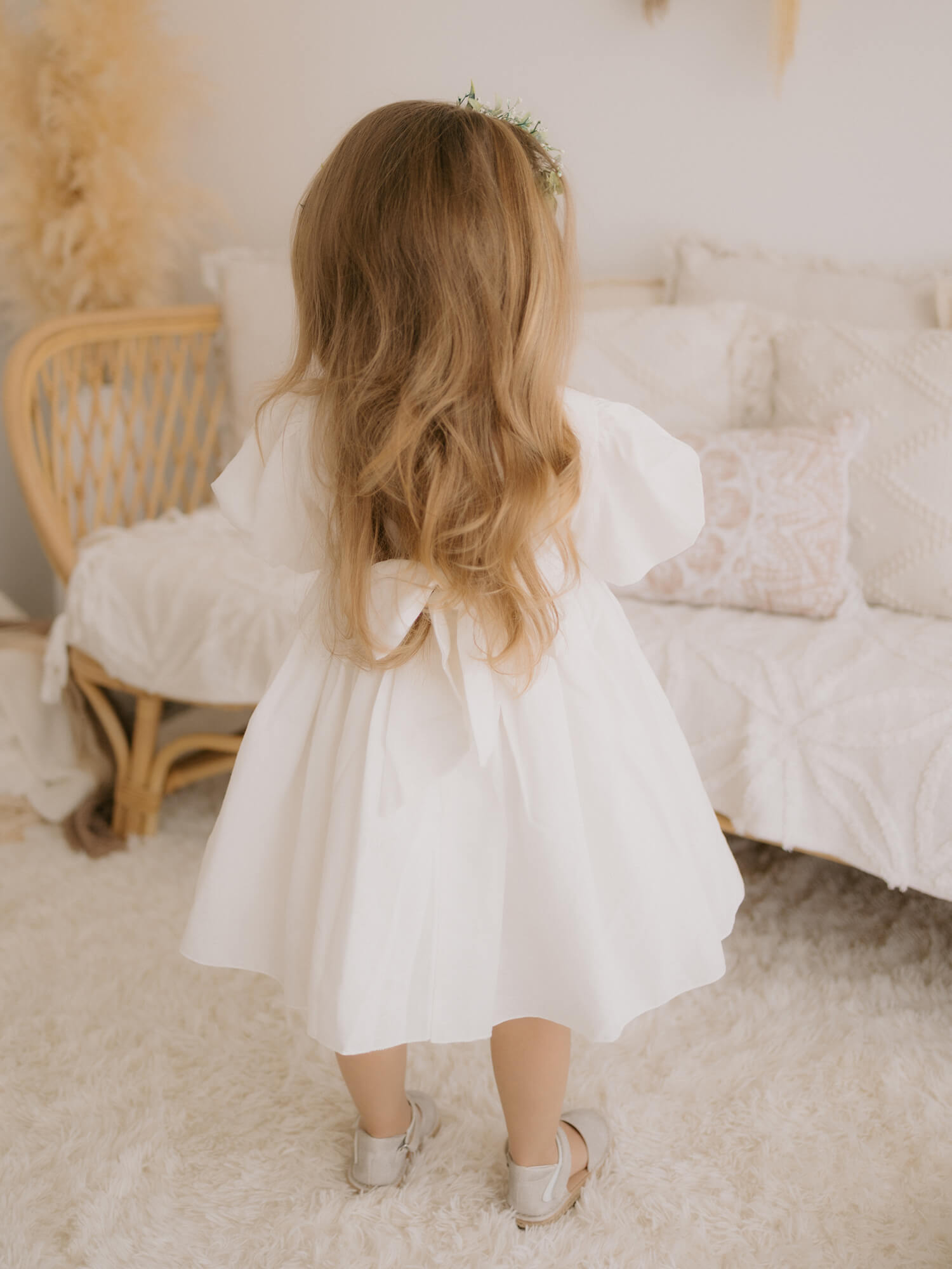 The back of our Cleo linen flower girl dress.