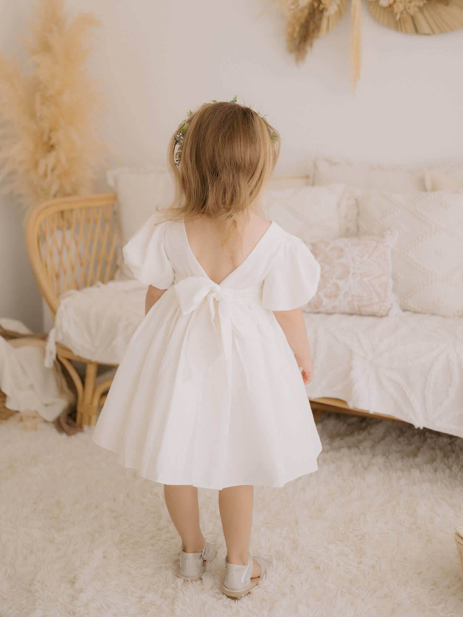 Cleo linen flower girl dress shown from the back.