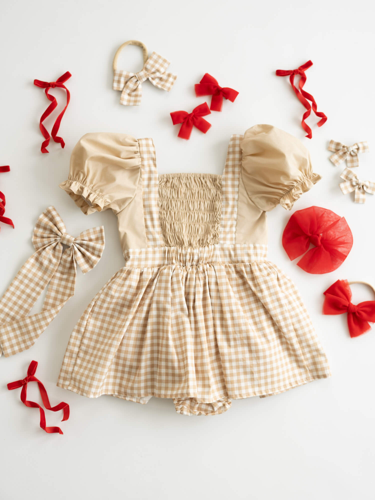 The back of our Ellie Gingerbread plaid baby romper.