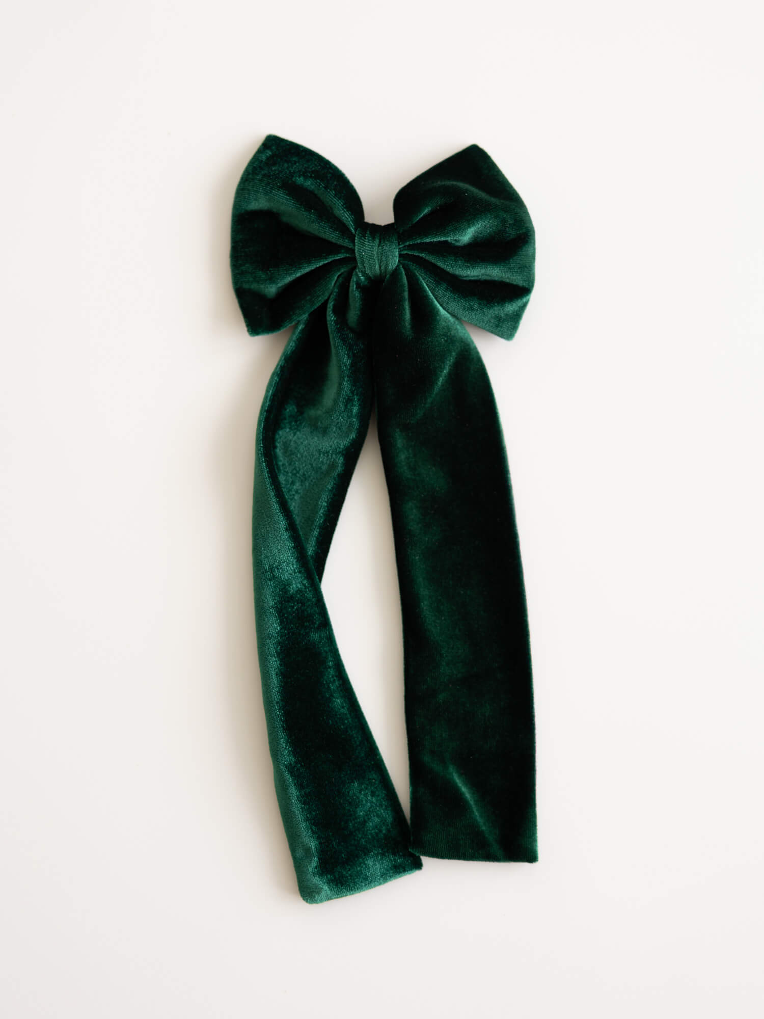 Medium velvet hair bow in emerald green.