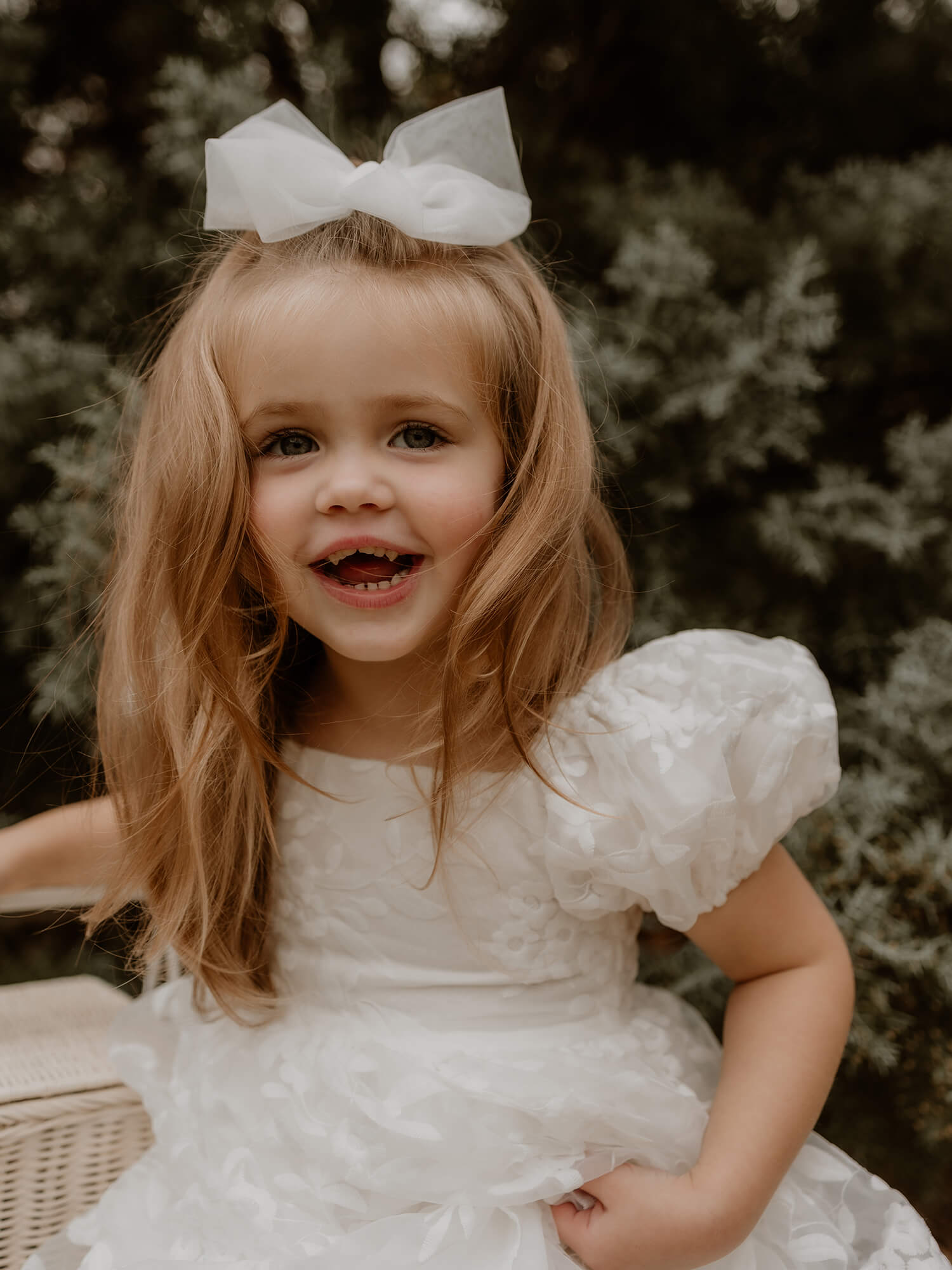 Close view showing lace details on our Kenzi flower girl dress.