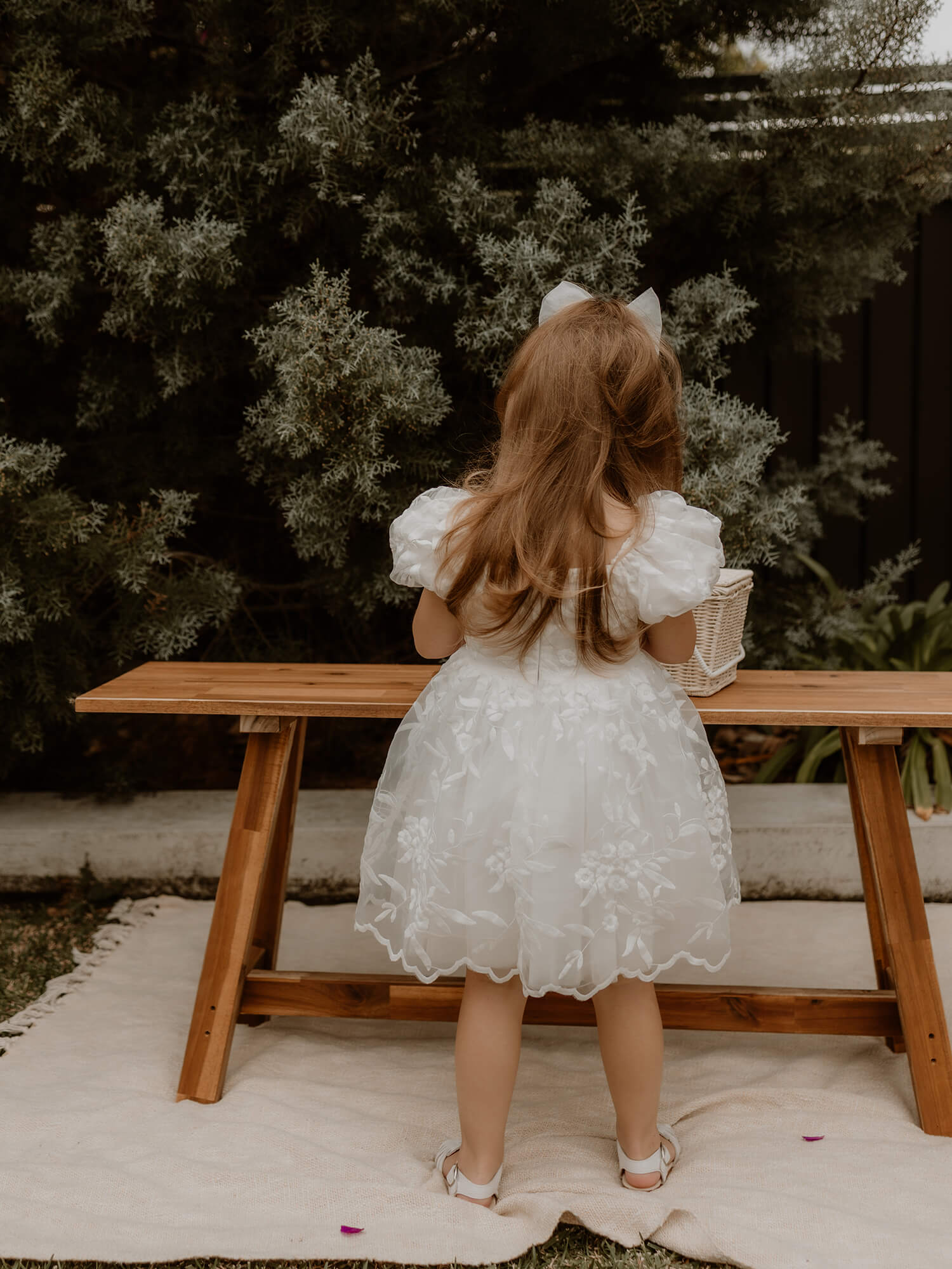 The back of our Kenzi lace puff sleeve flower girl dress.