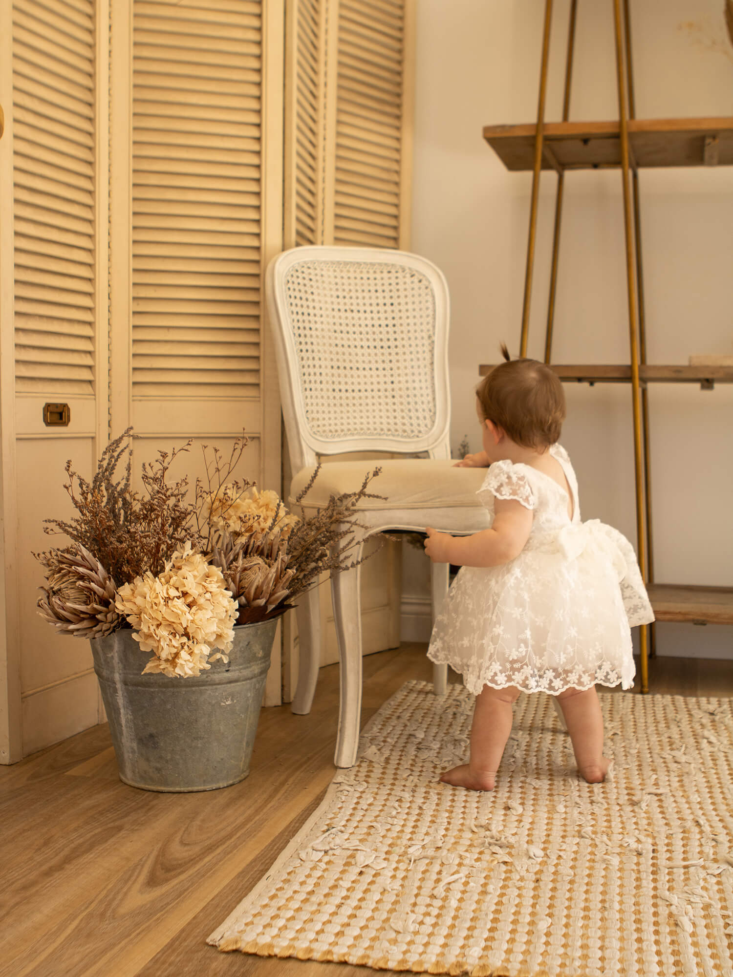 Pippa lace baby flower girl dress is worn by a toddler.