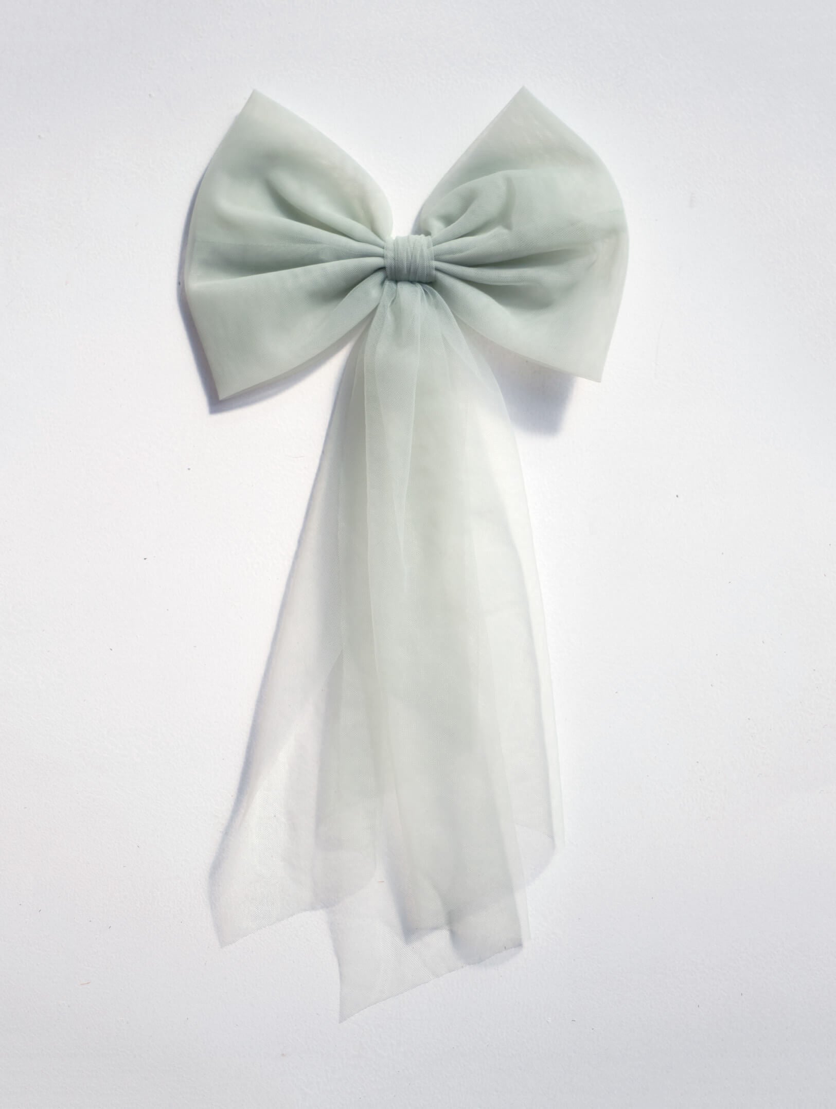 Large tulle bow in sage green.