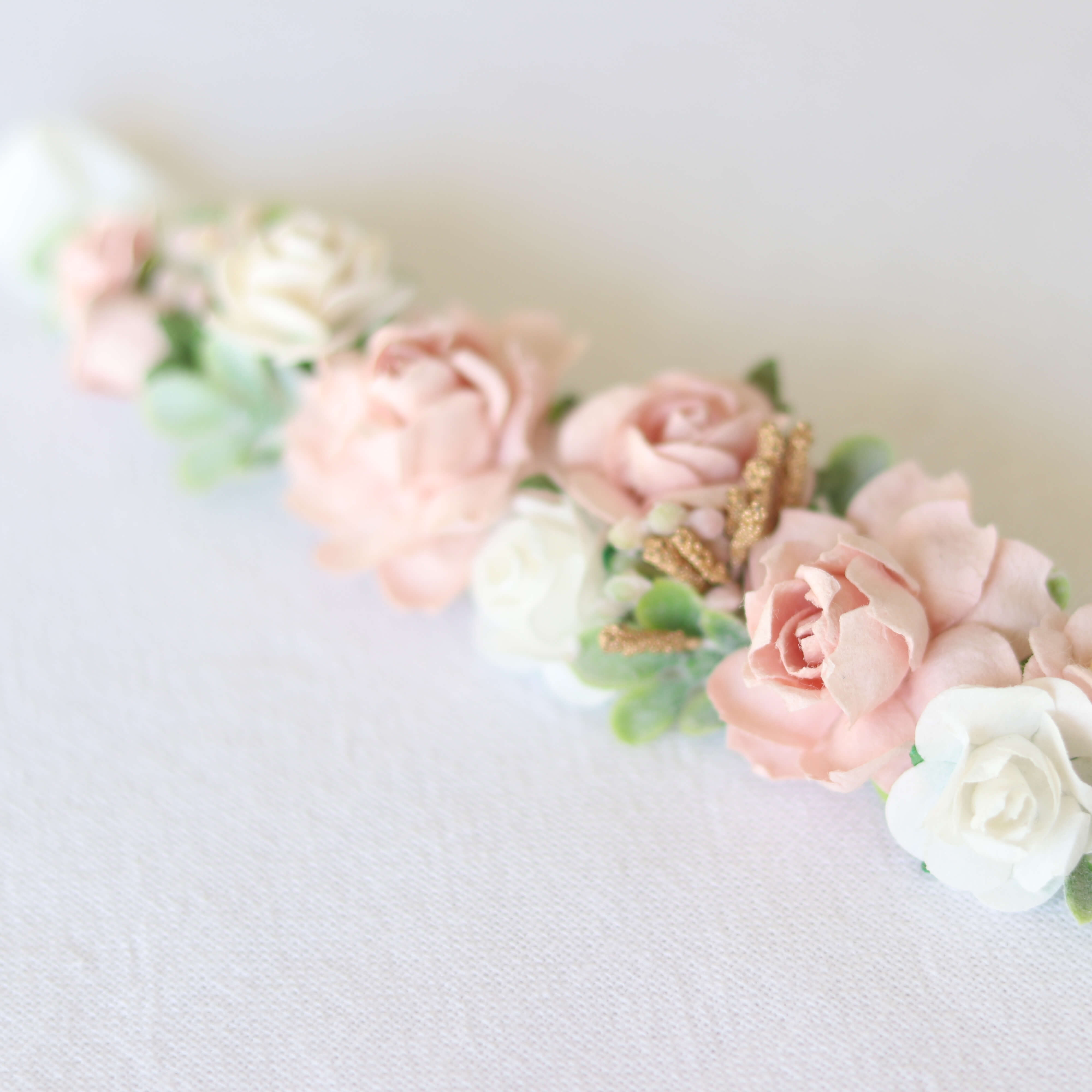 Details of our Amelie baby floral headband shown close up.