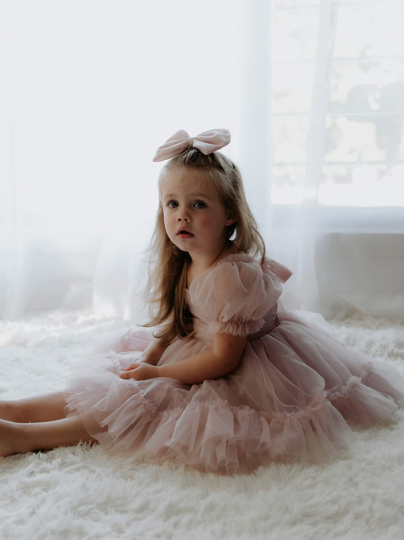 Girls special occasion dress collection showing our Gabrielle dusty pink flower girl dress.
