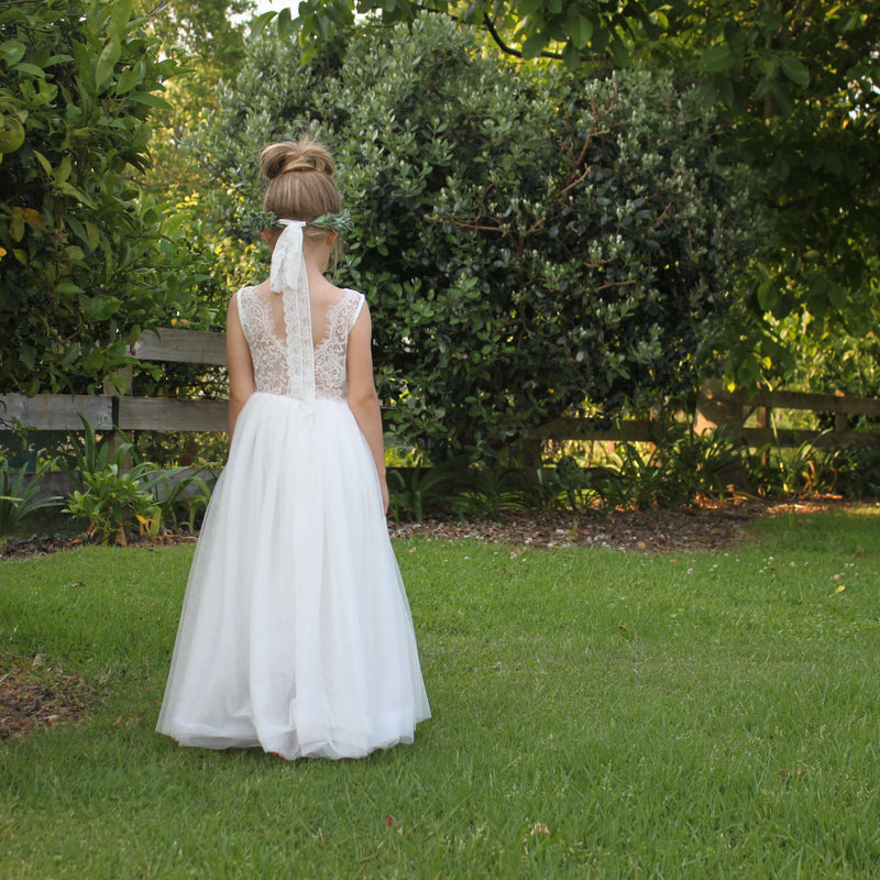 Mia ivory lace and tulle flower girl dress shown from behind. Showing the beautiful lace detailing.