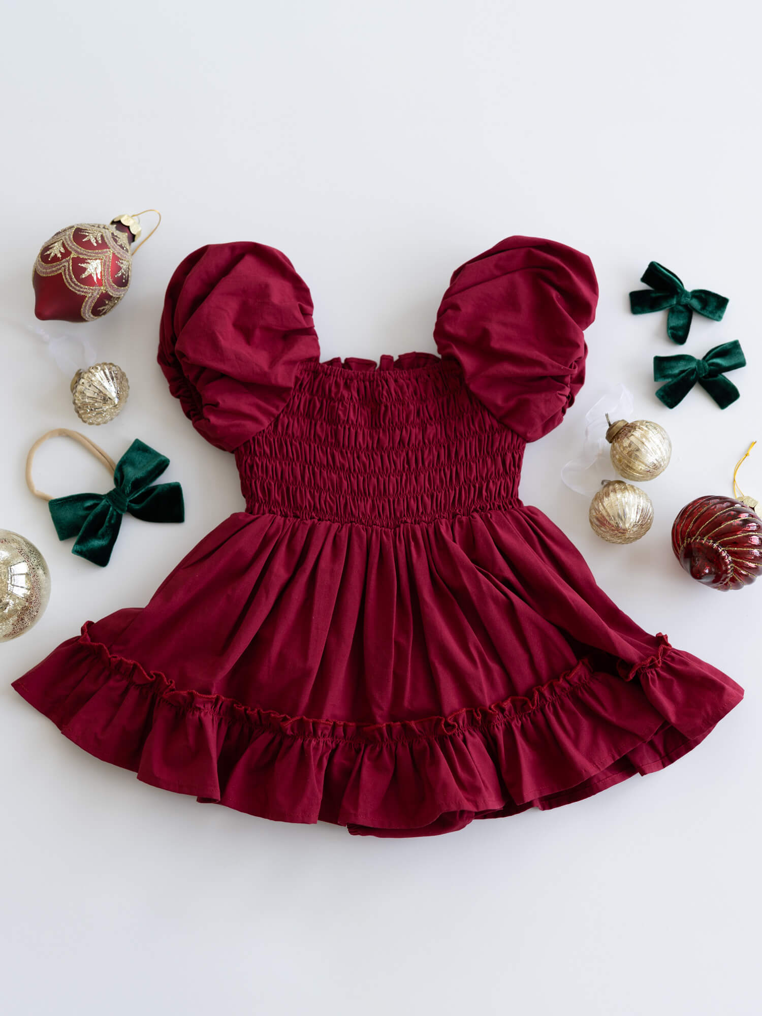 The back of our Ava crimson puff sleeve baby romper.