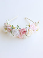 Callie ivory and blush flower girl headband shown from the front.