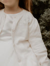 Floral embroidered details on our ivory Chloe flower girl cardigan.