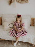 Cleo girls Christmas dress in candy cane stripe.