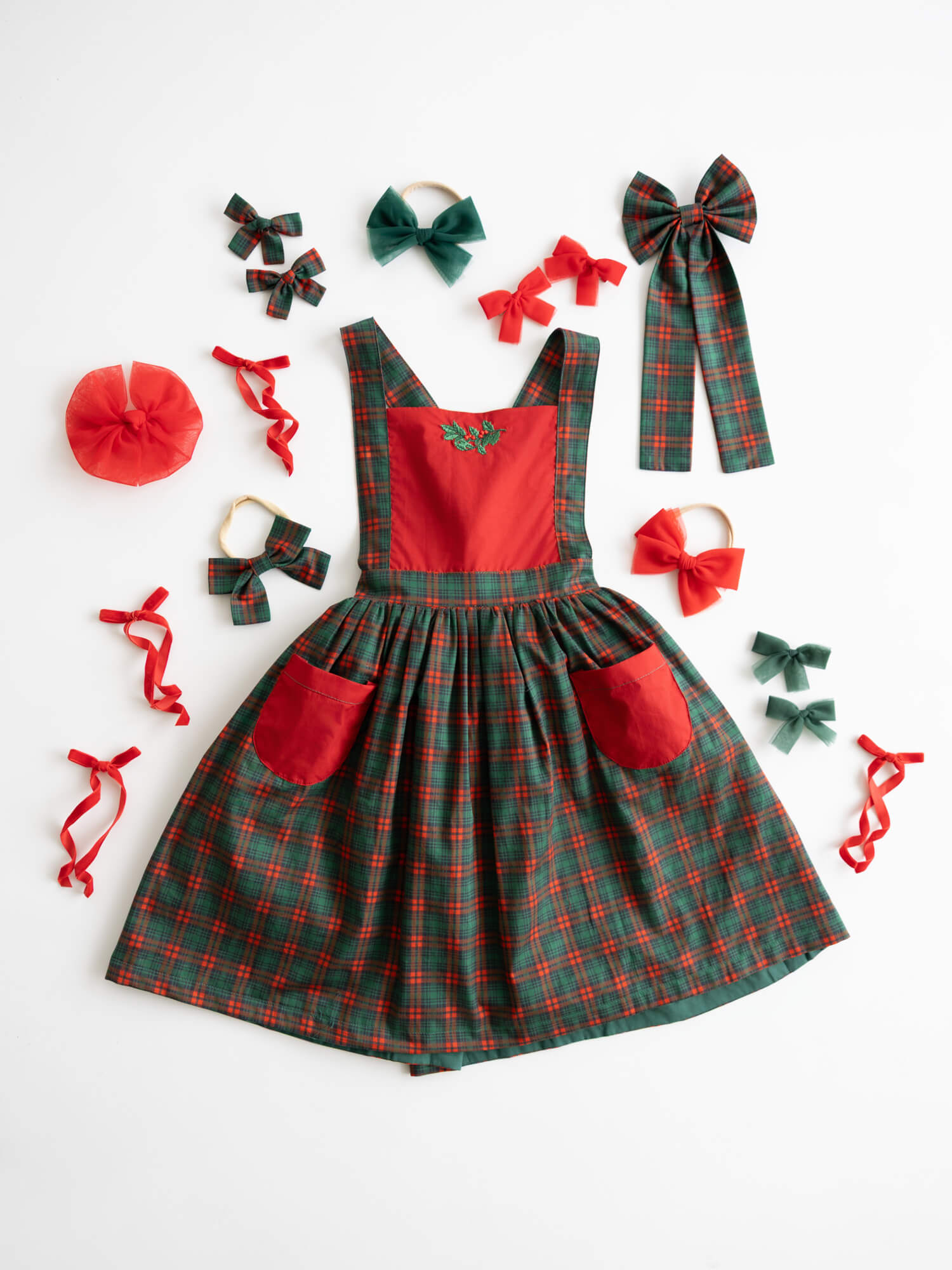 Ellie tartan girls Christmas dress and matching red and green accessories.
