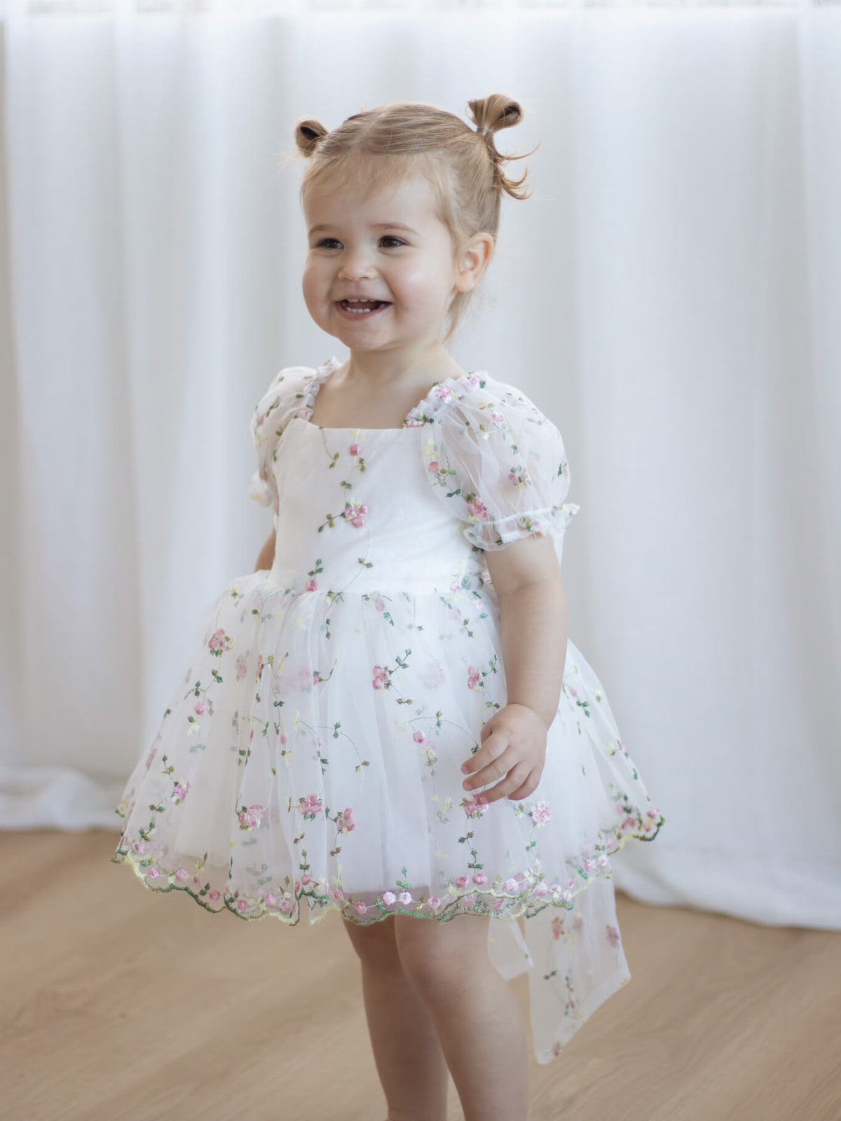 Fleur meadow pink flower girl romper with floral embroidery.