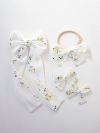 Fleur lemon blossom bows.
