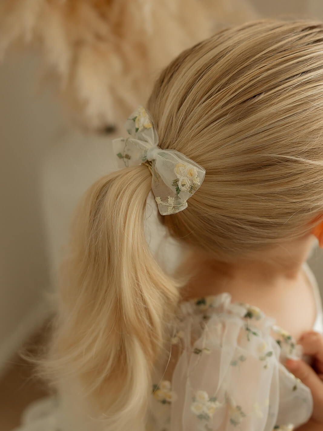 Fleur lemon blossom bow hair clip, in pigtail size.