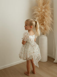 The back of our Fleur baby flower girl romper in meadow pink floral organza.