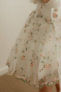 The meadow pink floral embroidered organza of our Fleur baby flower girl romper.