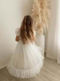 The back of our Gabrielle full length flower girl dress in ivory tulle.