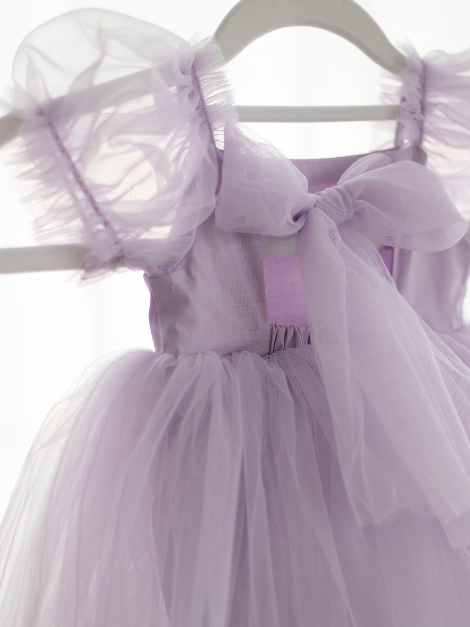 Back details of the Gabrielle lilac purple baby flower girl romper.
