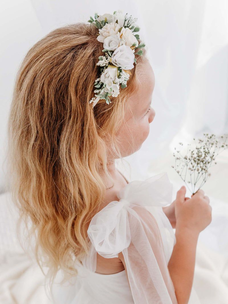 Callie ivory floral headband is worn by a flower girl. She also wears our Isla flower girl dress with tulle bow straps.