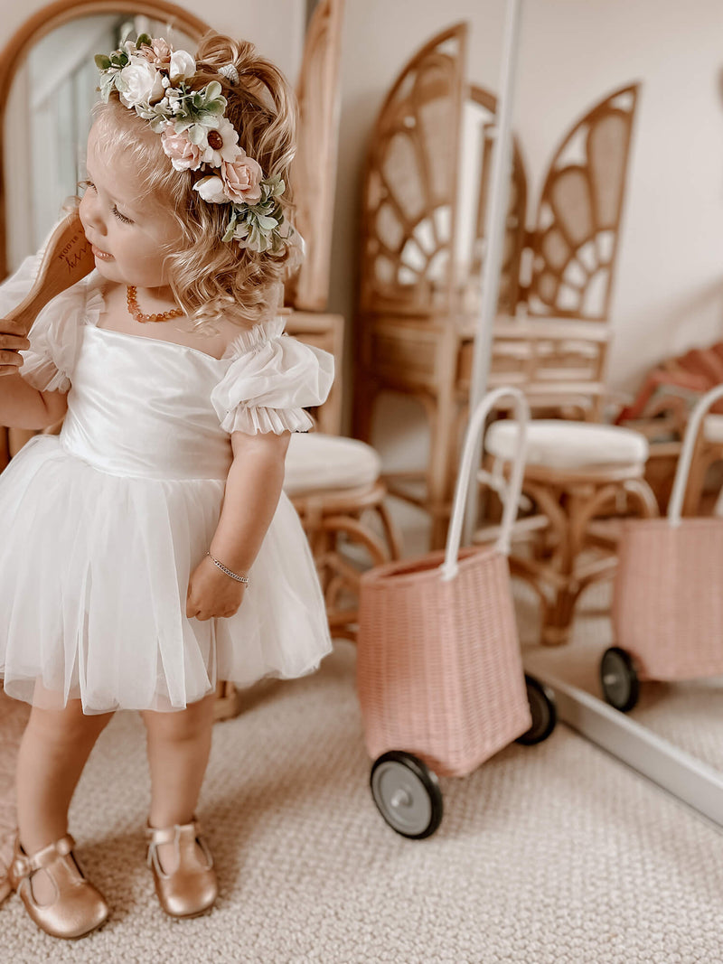 Layla baby flower girl dress is worn by a young girl, she also wears our Daisy flower crown.