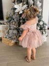 Layla baby flower girl dress romper in dusty pink is worn by a toddler.