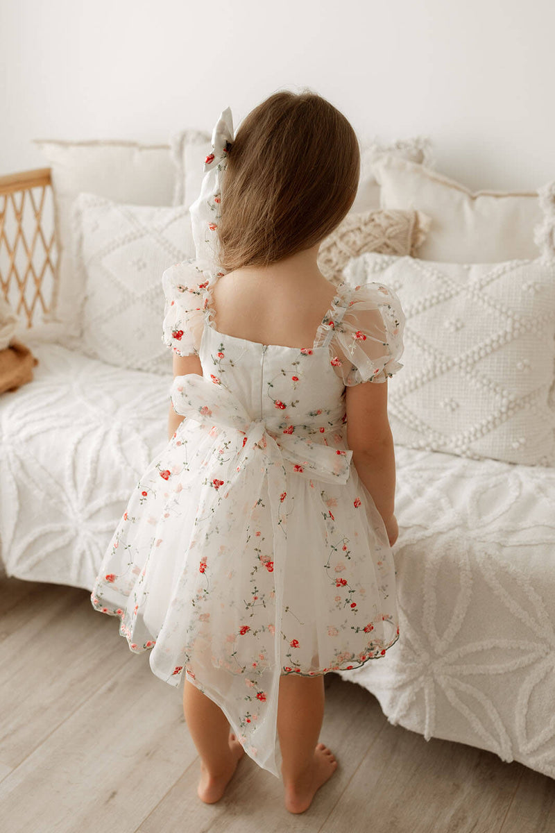 Layla organza Christmas and flower girl dress is worn by a young girl, showing the large organza bow at the back.