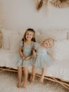 Layla dusty blue flower girl dress is worn by sisters, they also wear our dusty blue tulle bows.