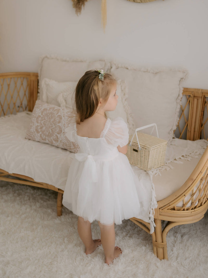 Our Layla flower girl dress is worn by a young girl.