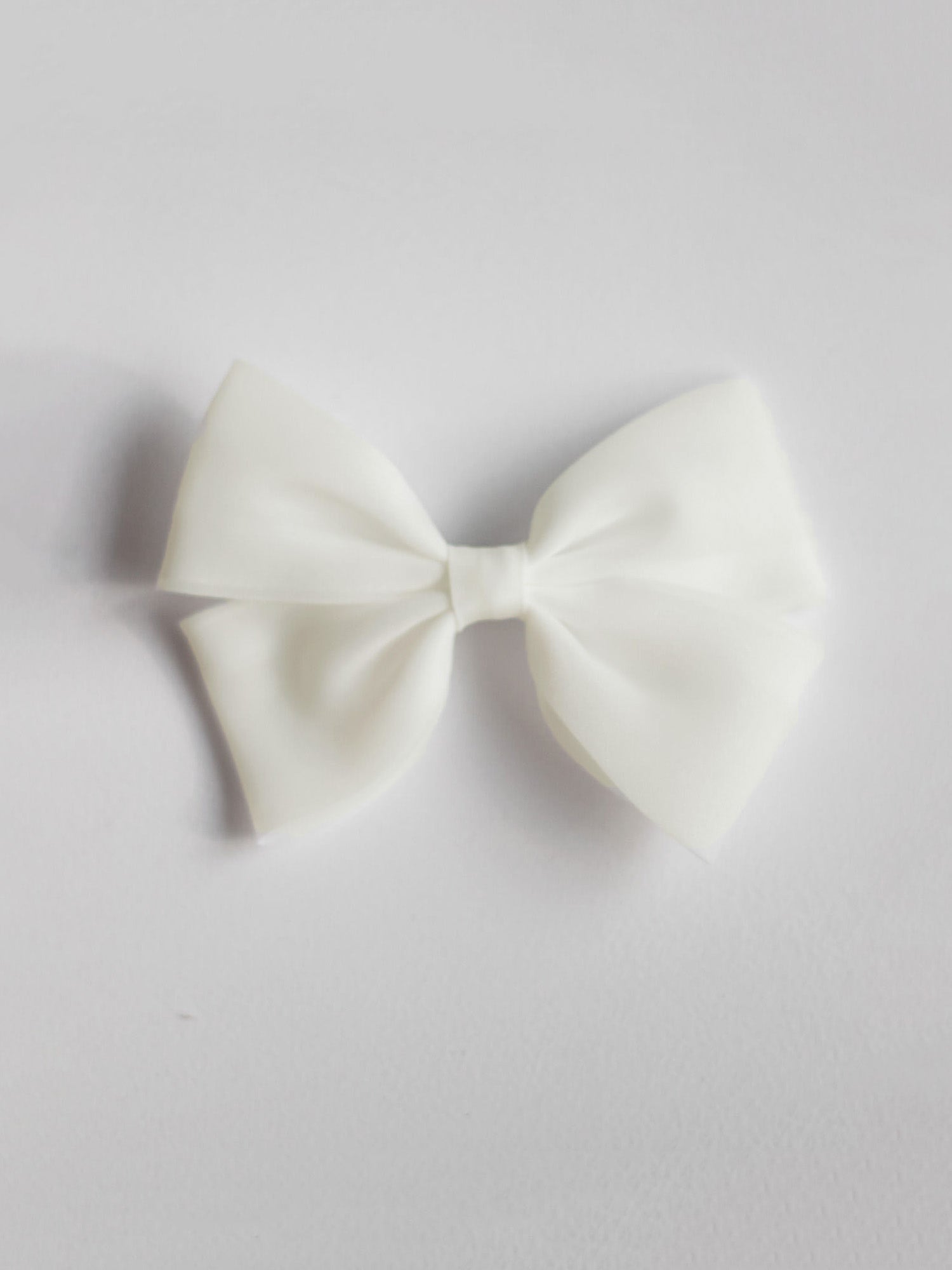 Cream organza bow hair clip.
