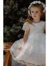 Pippa lace flower girl dress is worn by a young girl, along with a Rose flower crown.