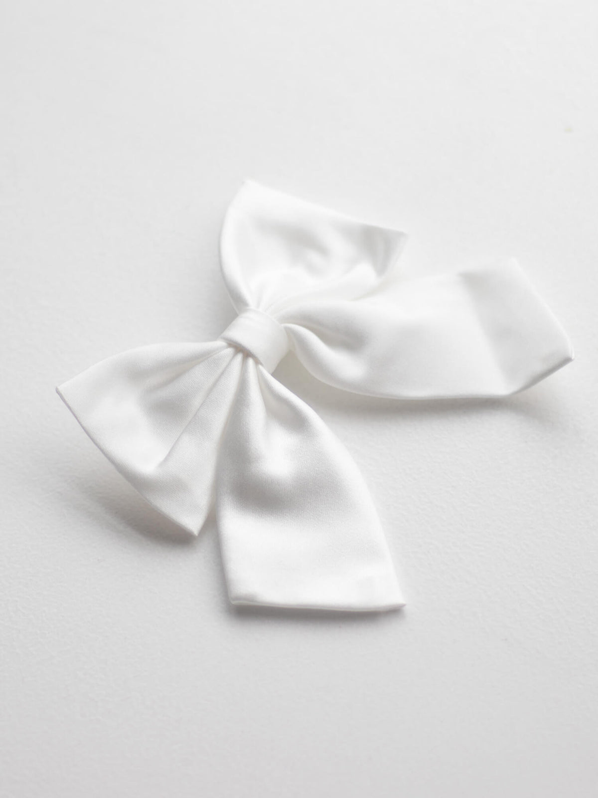 Girls ivory satin bow hair clip for flower girls.