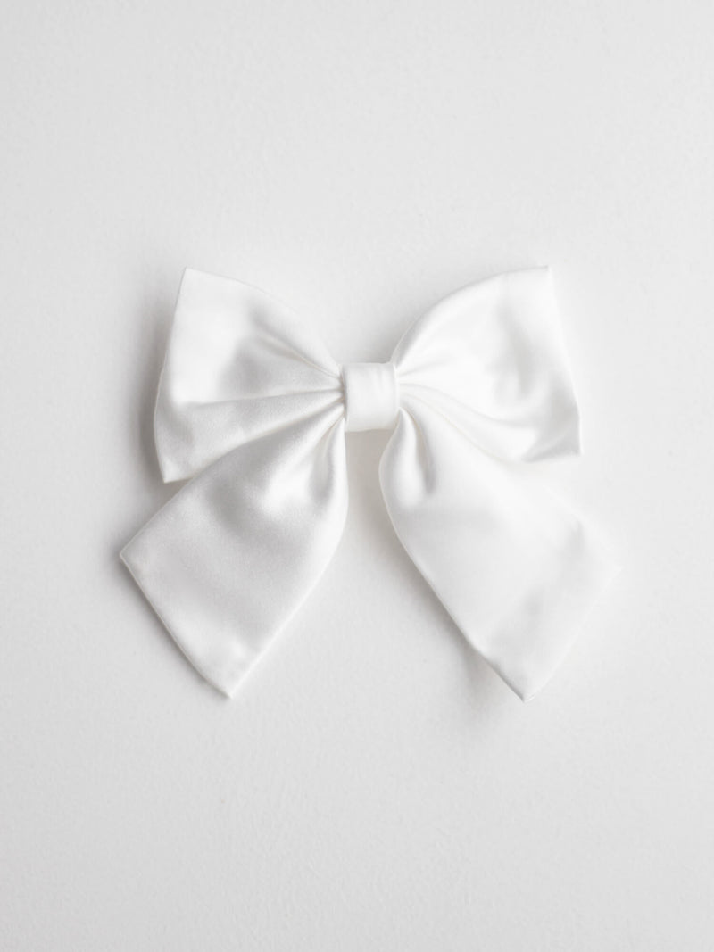 A sweet ivory satin bow clip to match your flower girl dress or special occasion dress.