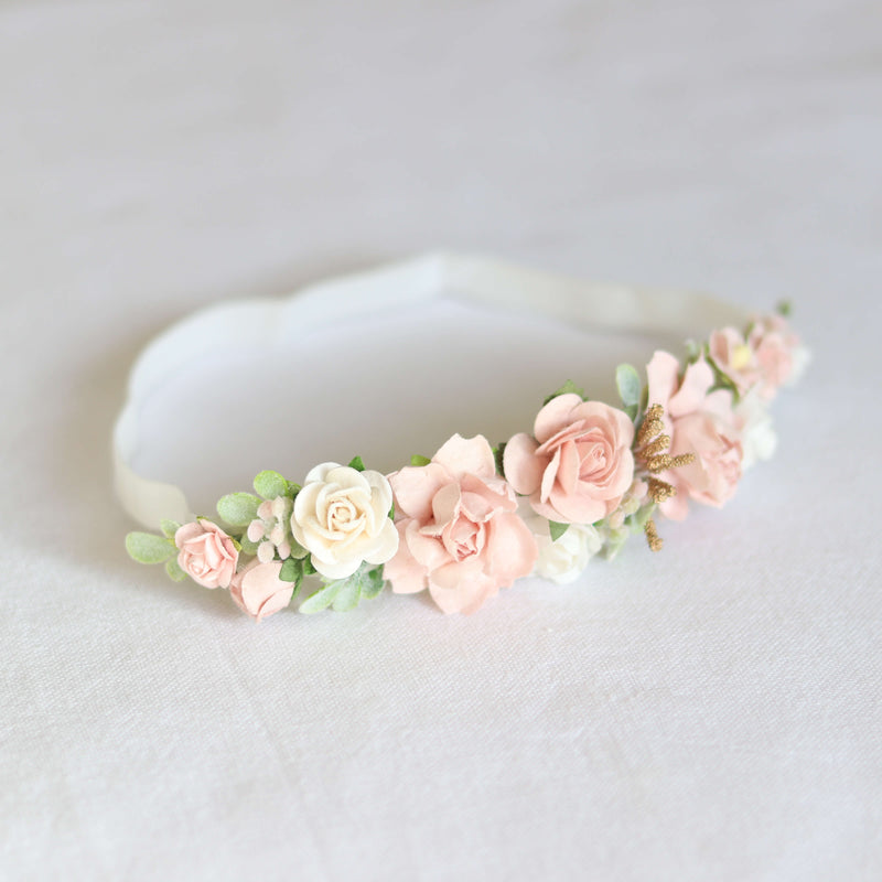 Side view of our Amelie baby floral headband. This flower crown is made up of dusty pink and ivory florals on a soft headband for babies.