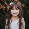 Child wearing our Aubrey wine and ivory floral headband and our Lumi lace flower girl dress.