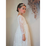 Lumi lace flower girl dress in ivory being worn by our young model, along with our Amelie flower crown.