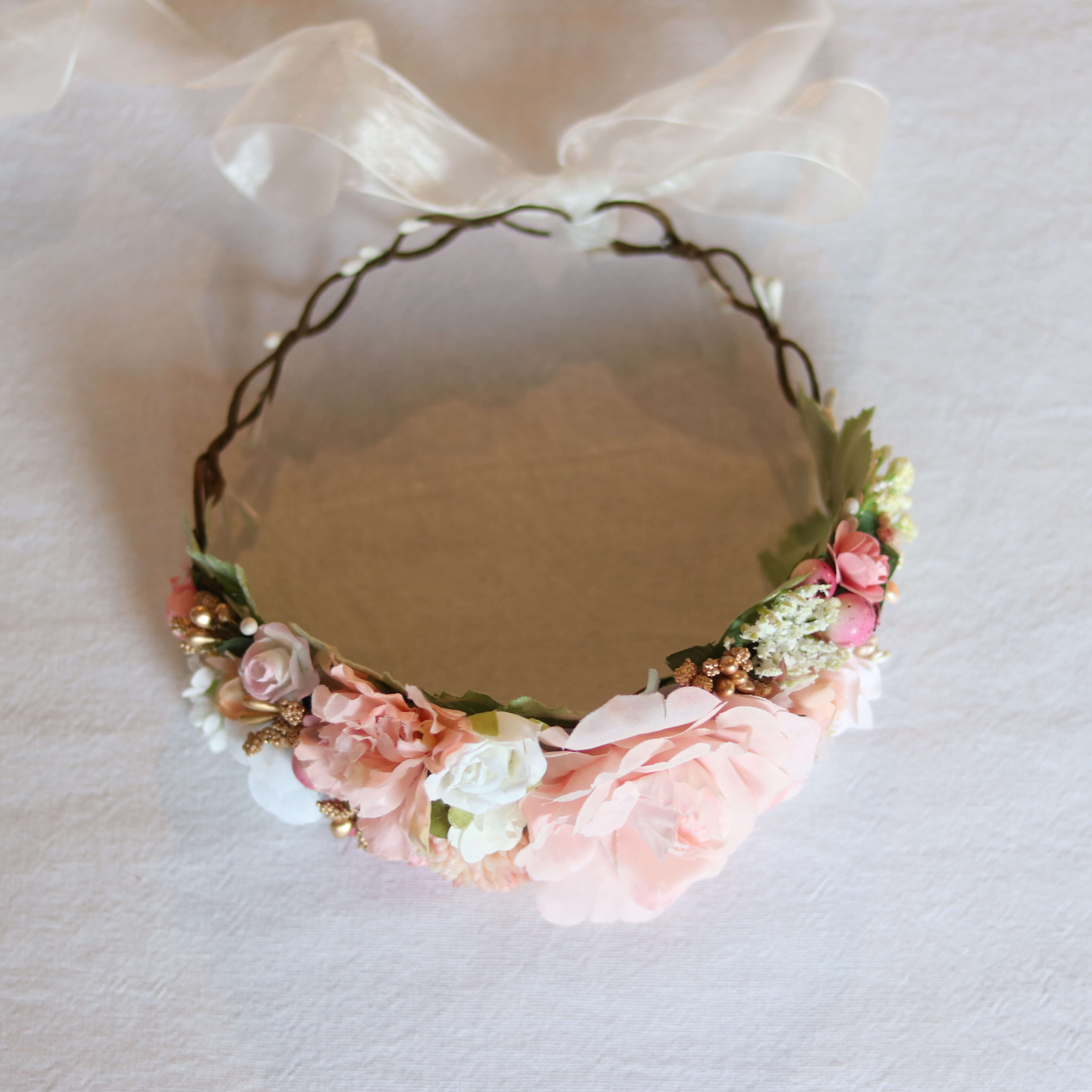 Aria flower girls flower crown shown from above, showing floral details and tie back ribbon.