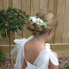 Ava ivory floral comb being worn by a child. She also wears our Harper tulle flower girl dress.