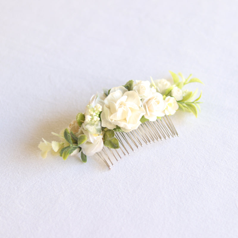Ava girls ivory floral comb showing ivory florals and greenery upon a hair comb. Suitable for flower girls and brides.