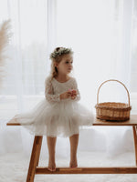 Belle flower girl dress in tea length is worn by a young girl, she also wears our Blythe greenery flower crown.