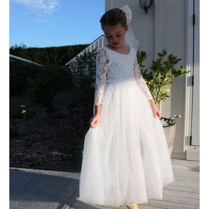 Lace flower girl dress, Belle dress, worn by a young girl along with our large tulle bow clip.