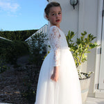 Belle lace flower girl dress worn by a young flower girl.