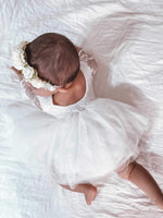 Briar long sleeve baby flower girl dress is worn by a young baby, along with our Sage baby floral headband.