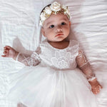 Baby girl wears our Sage baby flower crown and Briar lace flower girl dress. Sage baby floral headband. This Sage flower crown is ivory, sage and gold in colour. Perfect for baby or todder flower girls and special occasions.