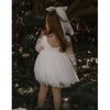 Briar long sleeve flower girl dress shown from the back on a young girl. Showing the scoop lace back.