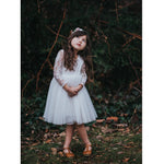 Flower girl wears our Briar lace and tulle ivory dress and our Layla flower crown.