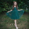 Gabrielle green flower girl dress is styled for Christmas and worn by a young girl.