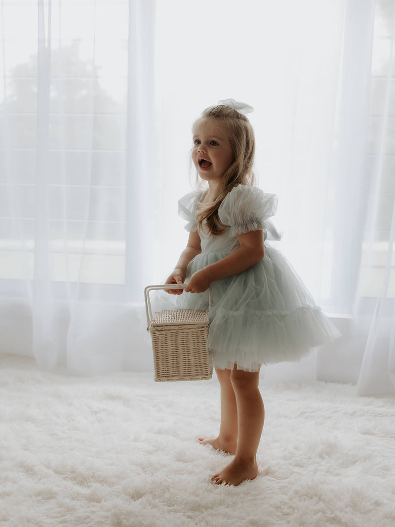 Tulle puff sleeves on our Gabrielle flower girl dress in blue.